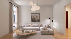 Lichte woonkamer met warme crèmewitte muren, beige bank en houten vloer